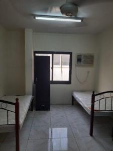 Sharing Room /Bed space for bachelor Near ADCB Metro ,Karama