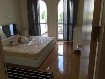 Furnished master bedroom with balcony in a villa in JVC
